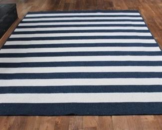 Blue striped rug.  8 x 10 rug $200.00. This item is at the West location.