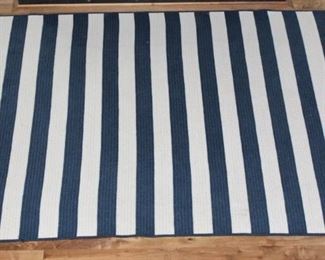 Blue striped rug.  8 x 10 rug $200.00. This item is at the West location.
