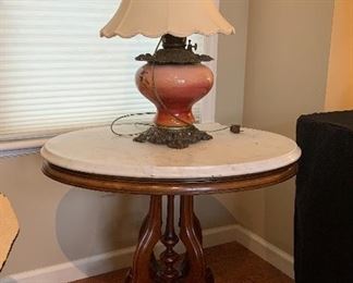 Lamp- Oil converted to electric, Pink glass globe                     Table- Victorian marble & black walnut, 27.5" H  x 28" W