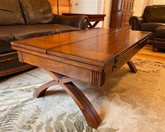 Contemporary expandable cross leg coffee table; great for game night! Two matching side tables available