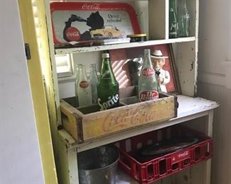 Primitive open shelving and Coke collectibles 