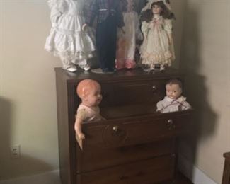 Vintage tall dress and some dolls hanging around