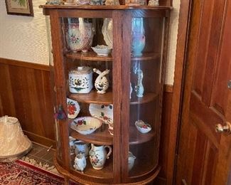 Vintage curio cabinet filled with treasures