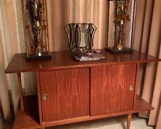 BID ITEM:-  MCM  cabinet with sliding doors, Made in Yugoslavia(fits LP records) W: 40", H: 26" D: 18" Pair wood carved hurricanes with dried flowers (sold individually) Luminara glass centerpiece with battery controlled candle and remote.
