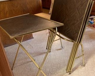 4 folding faux wood TV tables with rolling carrier