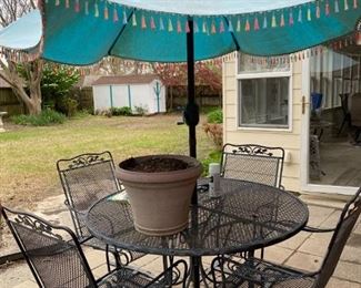 Wrought Iron Table with four chairs and Umbrella