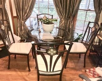 Round glass top table and chairs