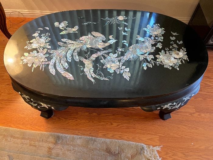 Gorgeous black lacquer and mother of pearl inlayed oval coffee table in excellent condition $600.00