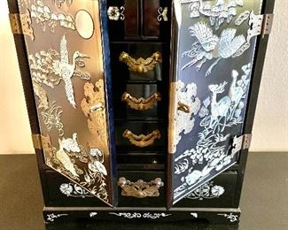Stunning black lacquer and mother of pearl inlay jewelry chest With brass hinges. 
Excellent condition like new $125.00
