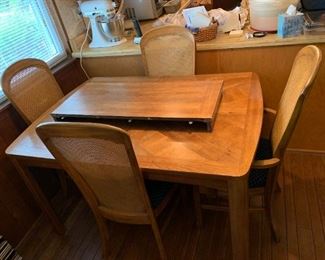 #4	Rectangle Table w/1 leaf w /6 chairs w/cane backs    54-70x38x29.5	 $150.00
