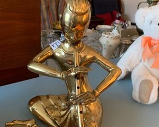 #89	Solid Brass Asian Man playing flute	 $20.00 

