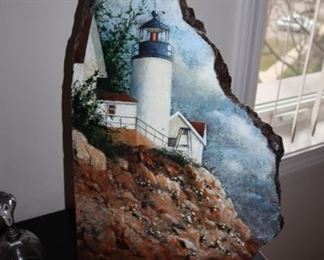 Lighthouse painted on granite by Marsha Abramsohn
