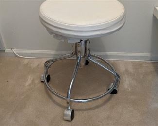 Chrome rolling vanity stool