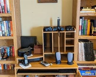 Computer desk, binoculars, computer speakers, VHS tapes