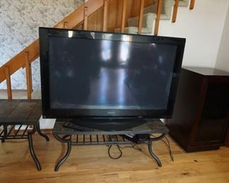 Flat screen TV, slate top tables, cabinet