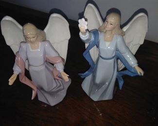 31.   2 ANGEL STATUES ABOUT 8" EACH $15 FOR THE PAIR