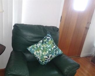 28. LEATHER CHAIR/ ROCKER $30 HAS SMALL AMOUNT OF DAMAGE SHOWN IN NEXT PICTURE