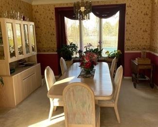 Dining room table (sits 12) with 6 padded chairs and hutch