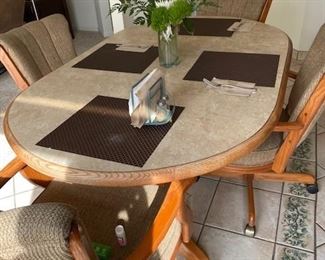 Kitchen Table with 4 padded chairs. Sits 6