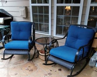Outdoor rocking chairs, and table. $250.00. These are high end chairs