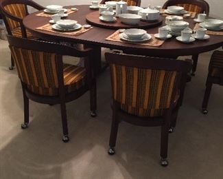 Teakwood table and 6 rolling chairs excellent condition 