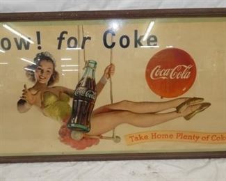 59X31 FRAMED SWINGING COKE CARDBOARD