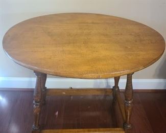 Vintage table handcrafted by the owners father. Frame and legs are unique in style with arch way top and spindle legs connect all supporting a oval table top. Measures 30" x 24" x 28". https://ctbids.com/#!/description/share/821778