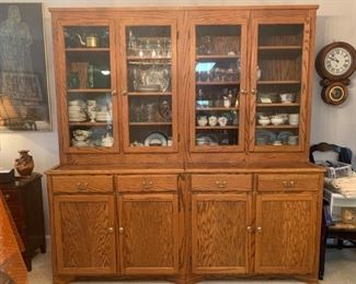 China cabinet custom made from oak wood that has been accented with glass panels, brass knobs and handles. The piece is sectional and designed to separate in the middle. There are a couple of water spots but over all the condition of the cabinet is great. Nothing in the cabinets are included just the cabinets are for sale. 81x25x84”. https://ctbids.com/#!/description/share/821737