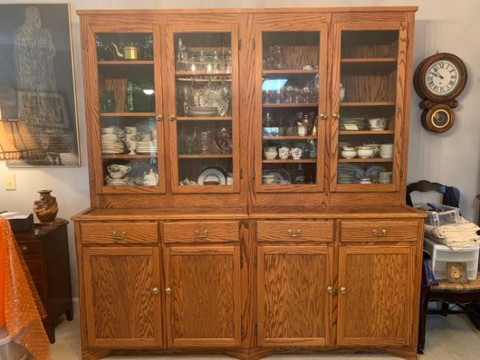 China cabinet custom made from oak wood that has been accented with glass panels, brass knobs and handles. The piece is sectional and designed to separate in the middle. There are a couple of water spots but over all the condition of the cabinet is great. Nothing in the cabinets are included just the cabinets are for sale. 81x25x84”. https://ctbids.com/#!/description/share/821737