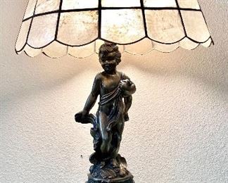 24- $50 Lamp shell capiz shade with metal cherub figure 14”W x 22”H 