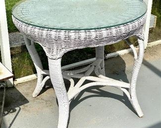 61. Round wicker table 34”round with four chairs 				$140	