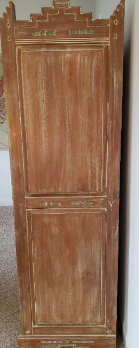 Side of cabinet.