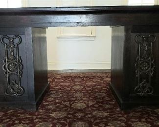 Masculine iron accented desk with custom glass top.