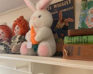 Vintage books, handmade Raggedy Ann and Andy. 