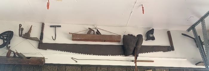 Antique 2 person saw, wooden planers, rustic farm tools. 