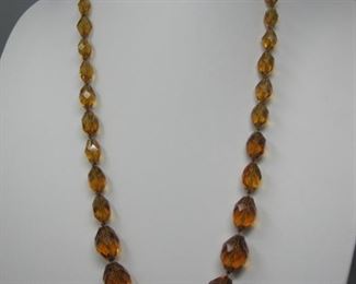 $8.00, Faceted Amber glass beads 26"