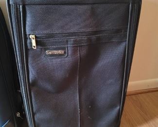 $20.00. Black samsonite suitcase, 22 x 13 x9" VG condition