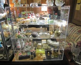 Sterling Salt & Peppers plus Colognes and Perfumes with an assortment of collectible knickknacks.