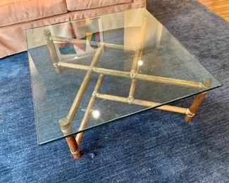 $295 - Glass top coffee table with 36 in. square x 16 in. H with wood and leather base