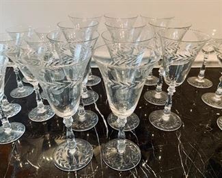 $240 - Collection of hand-etched "laurel leaf" crystal stemware with three size; seven (7) 6 1/2 in. H; six (6) coupe 6 in. H, Eleven (11) 8 in. H