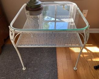 Painted white metal side table with glass top