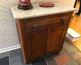Marble topped antique cabinet