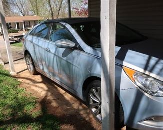   view  of  car-  it  is  in  nice  condition  and  is  silver  blue  pearl  color.   it  is  a  2013  Hyundai  Sonata.  It  has 76,622 miles.  There is a moon  roof.  It  had one  owner.  Price  is  9995.00