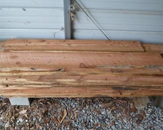 Rough cut cedar planks some with live edge