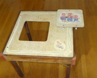 Antique high-chair desk.  This had a removable center and allowed you to put a seat in as a play desk.  The legs extend to adjust the size. 