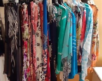 Closets full of designer woman's clothing! Dresses, skirts, beachwear, tops, shoes and more! Most large or X-large