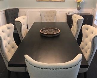 Stunning John M Smithe BristowDining Table  Measures  42 wide 90 inches long without butterfly extension., Extends to 122 inches. Coffee finish. It is paired with 6 Gramercy Tufted dining Room Chairs. They are formal but still have a casual farmhouse vibe.  This table is still available and in stock. Sale: $1,943. Regular Price: $2,429.00. 
Chairs are also still available in stock at WM Smythe Sale: $311.20 Regular Price: $389.00  for EACH CHAIR. One chair has some staining. Retail is well over $3500 new on this set. 
We are asking $1950 for the set. Two dark chairs also available. Happy to presell and show. 
