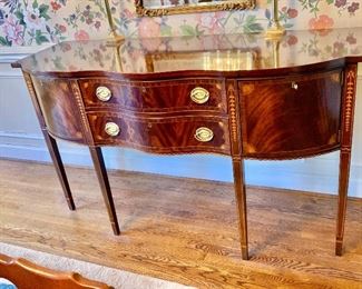 $695 - Council, flame mahogany sideboard with bell flower inlay.   38.5"H; 66"W; 24"D  