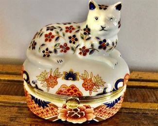 $30  Cat porcelain perched on lidded box  Orange blue and white.  4"H; 4"W; 3"D