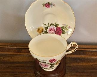 $25 Regency English cup and saucer set on wood stand.  Set with stand: 7"H; 6"W; 6"D 